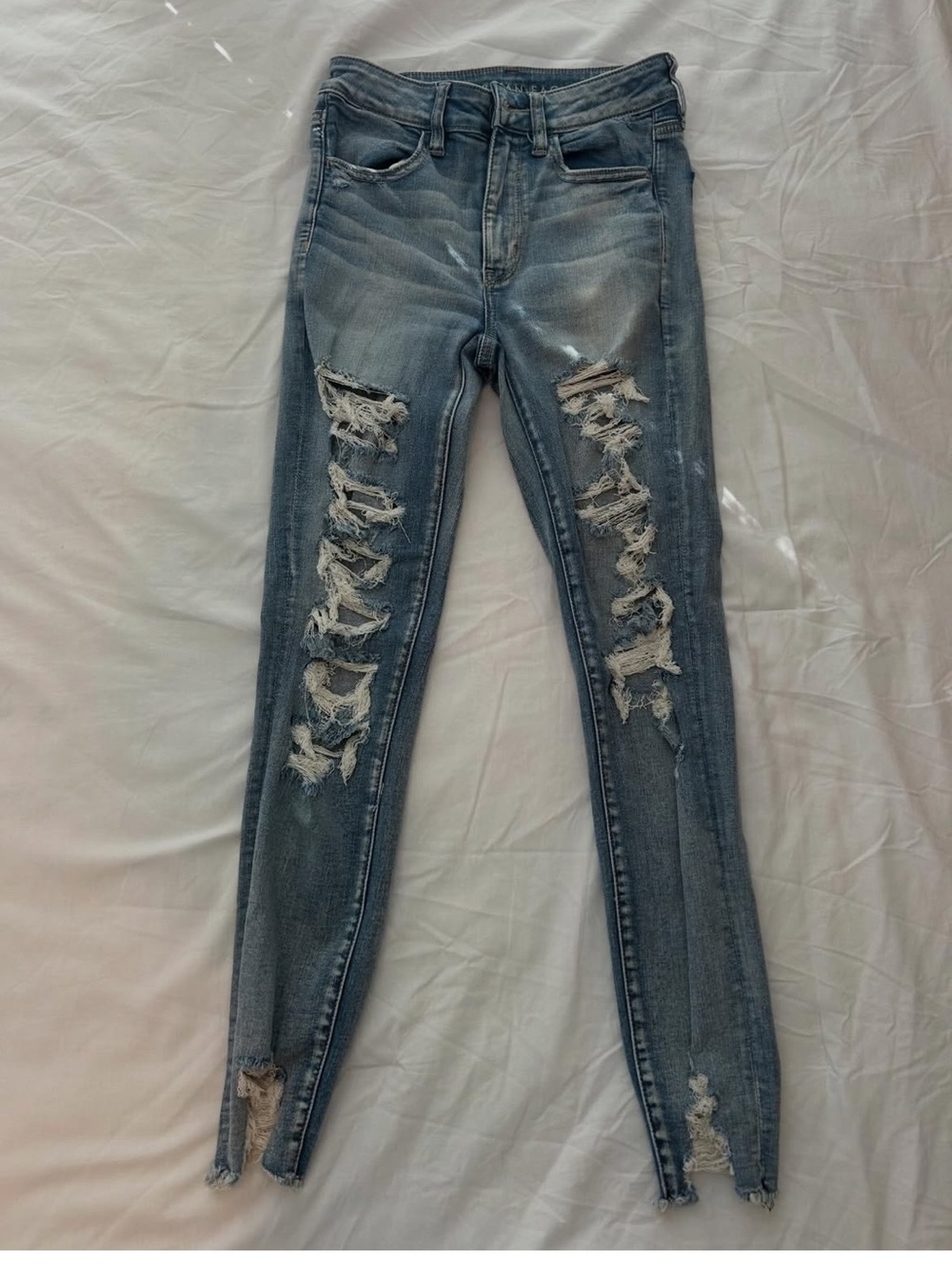 American Eagle Distressed Next-Level High Rise Skinny Jeans in Light Wash